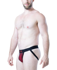 Male model wearing Nasty Pig black and red flame print jockstrap with black elastic waistband and leg straps