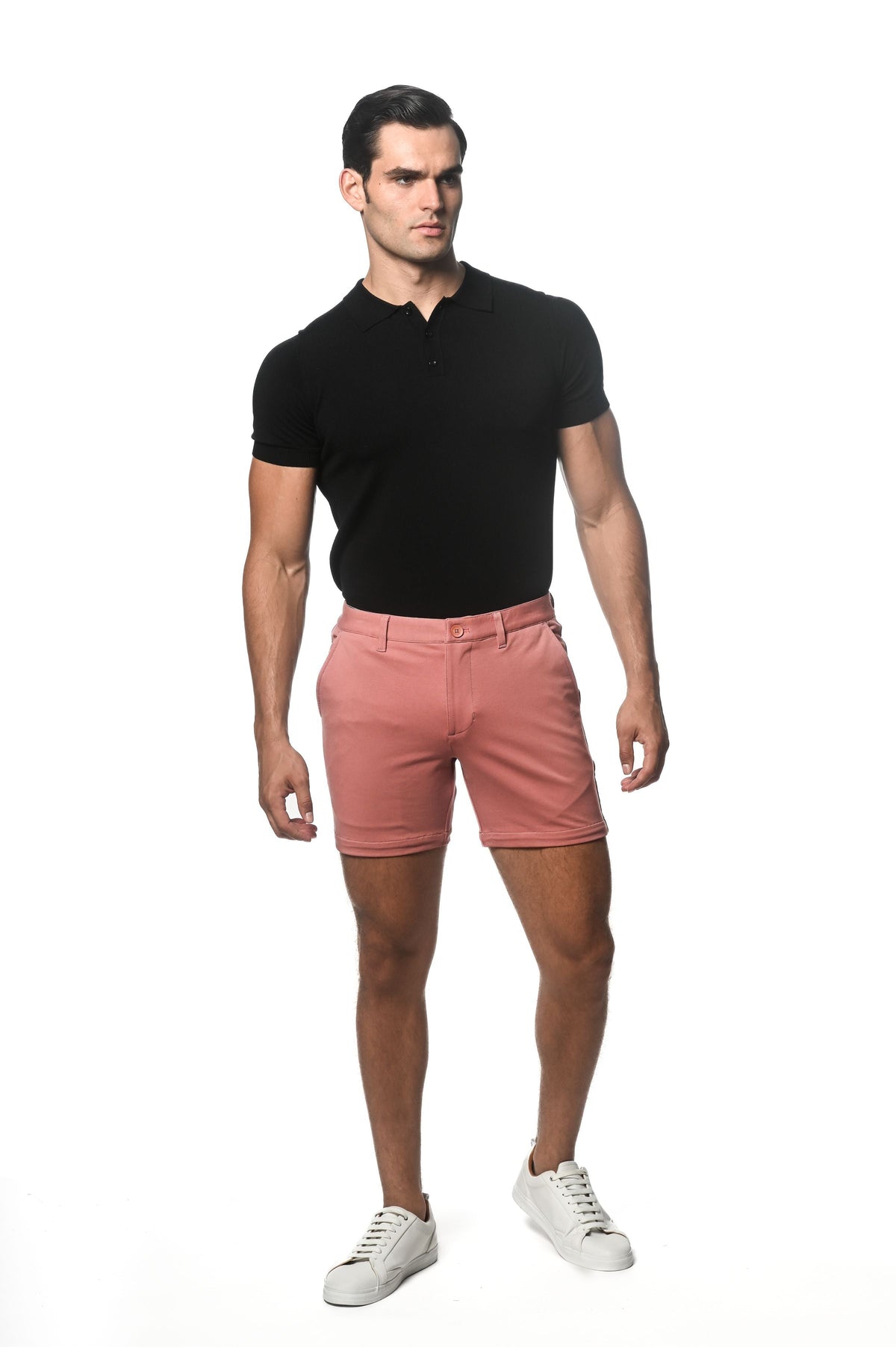 Crisp pink textured stretch knit chino shorts with a classic five-pocket design and button closure