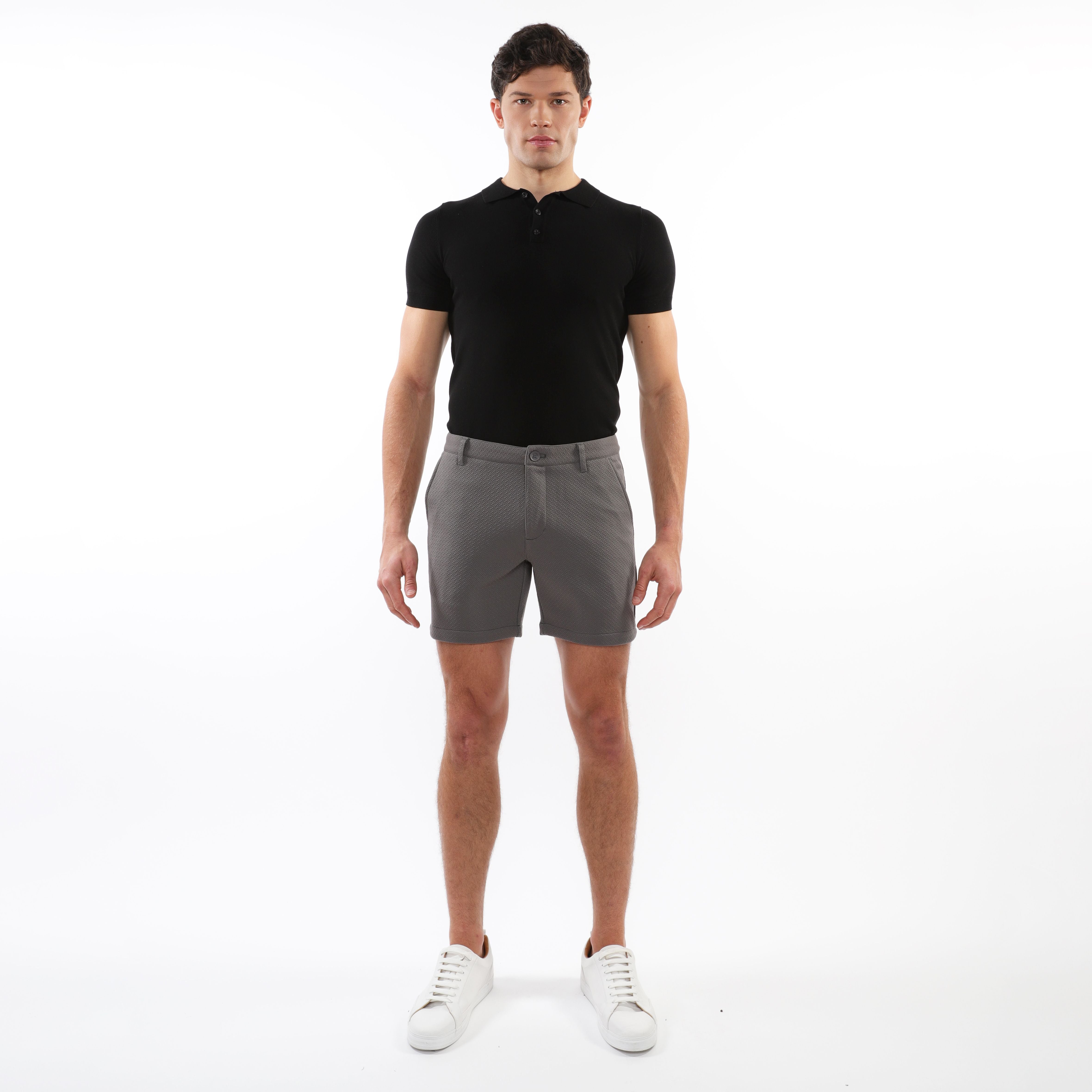 Gray textured stretch knit chino shorts with subtle weave and classic tapered fit for casual wear