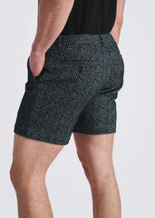 Rear view of man wearing POSTMARC black and gray herringbone jacquard knit chino shorts with back button pocket and side pockets