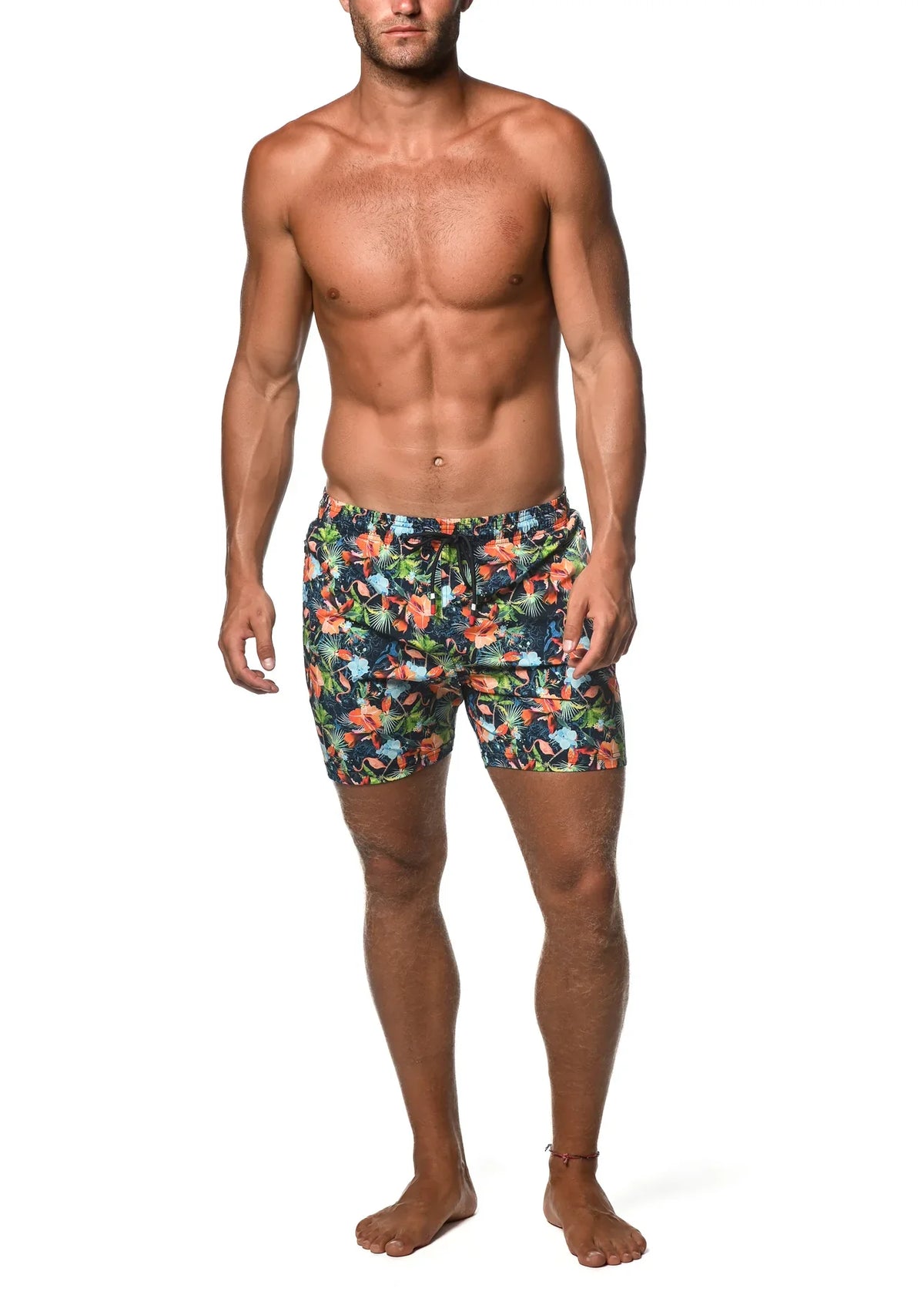 Moritz 6 inch inseam swim short in vibrant orange blue and green tropical floral print on dark navy base
