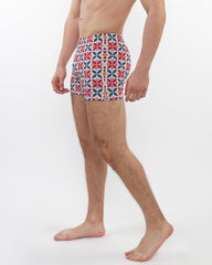 Seersucker swim shorts with mesh lining featuring colorful red blue and white geometric patterns