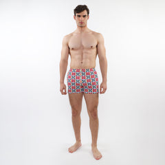 Seersucker swim shorts with mesh lining featuring vibrant red blue and white geometric patterned men’s swim trunks