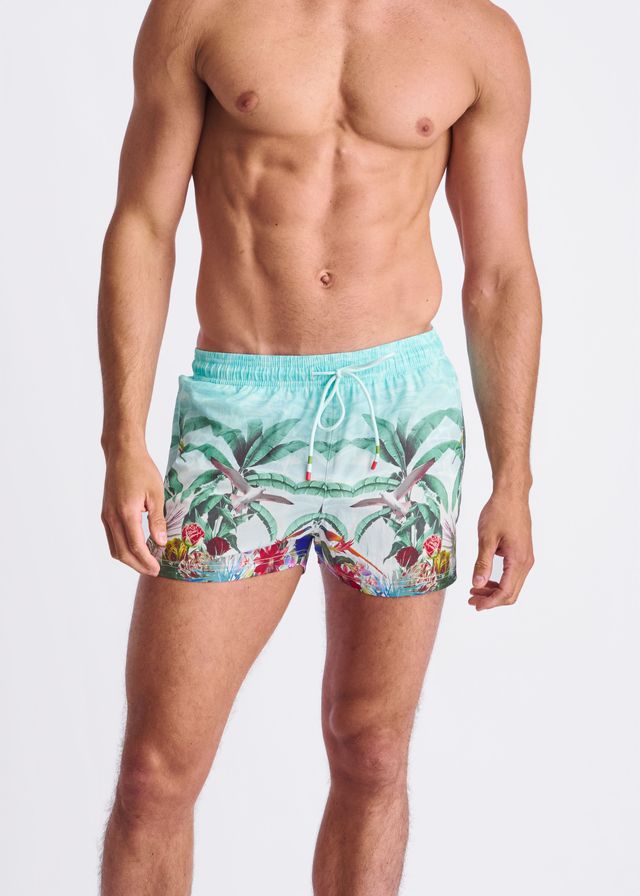 Light blue tropics print swim shorts with mesh lining featuring vibrant palm trees birds and flowers design
