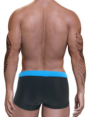 Back view of a muscular man wearing blue and dark grey square-cut swim trunks with a pouch design.