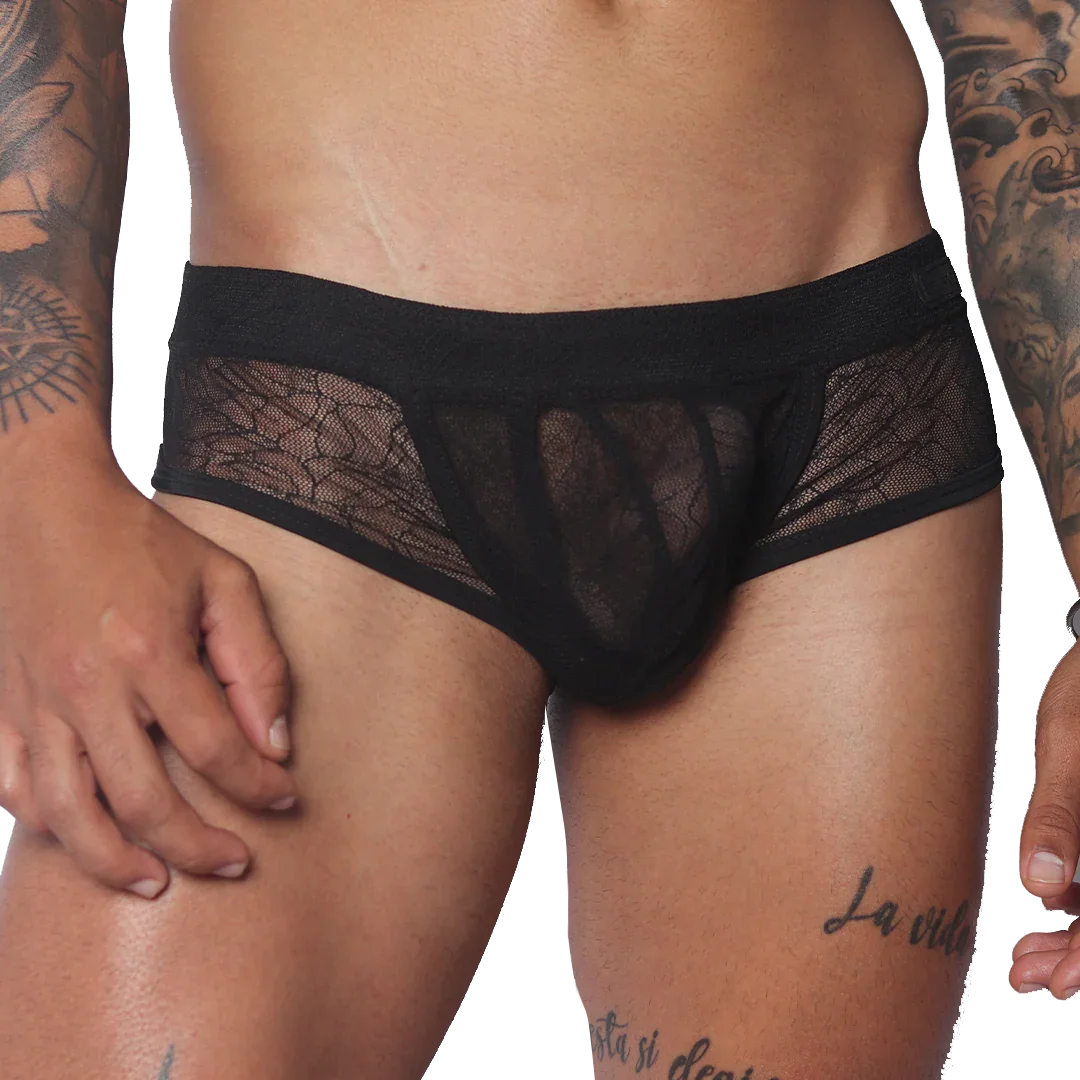 Black men's trunk underwear featuring a sheer, delicate floral lace pattern, a solid waistband, and solid front panel.