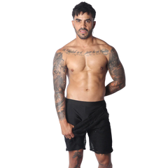 Form-fitting black athletic shorts featuring a layered design with a sheer, open-mesh outer panel.
