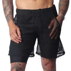 Black athletic shorts with an elastic waistband, featuring a sheer, oversized mesh outer layer over solid lining.