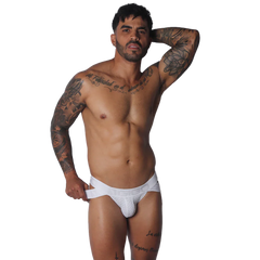 White jockstrap with textured pouch, branded elastic waistband, and side strap detailing.