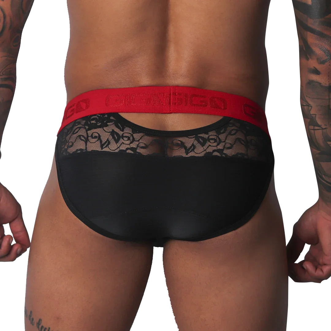Black brief with sheer floral lace upper panel, solid black lower section, and a bold red branded elastic waistband.