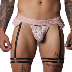 Romantic pink lace Gigo jockstrap with frilled edges, branded elastic waistband, and black adjustable leg garters.