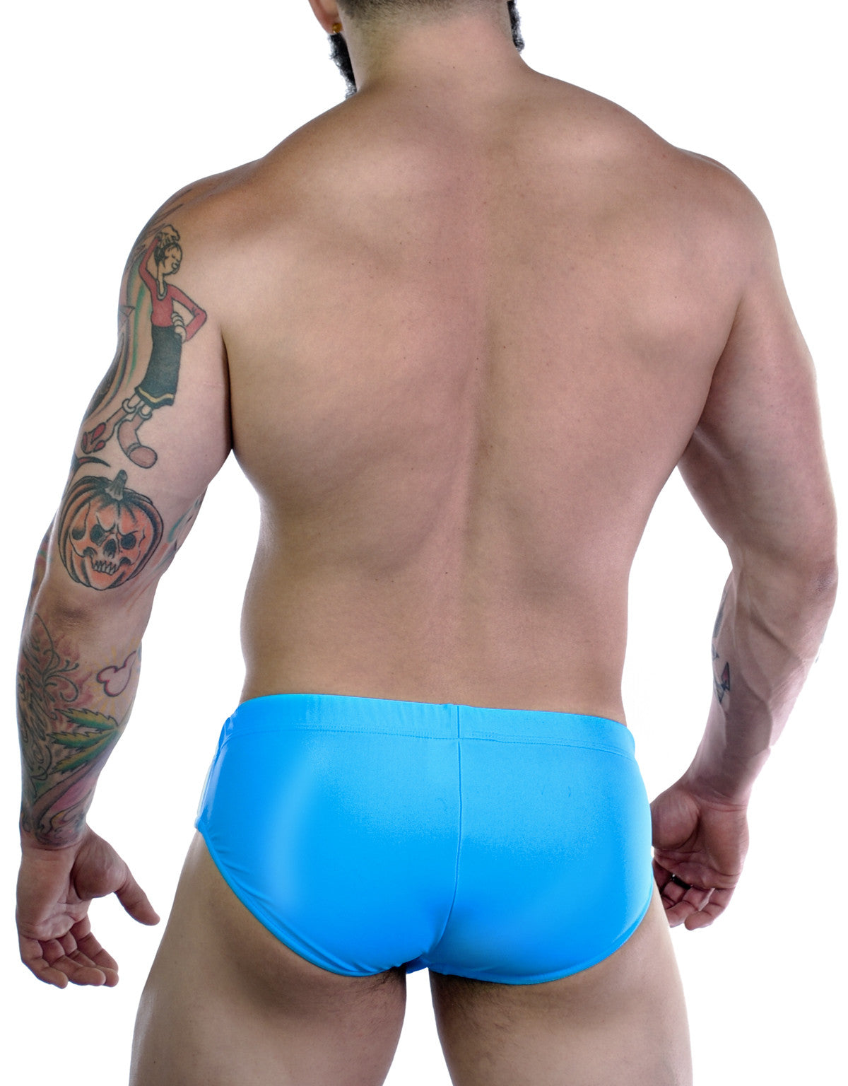 Back view of a muscular man wearing a solid bright teal Sportivo bikini brief with a smooth, fitted design.
