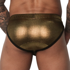 Metallic gold brief with a textured finish, thick waistband, and black trim, worn from the back.