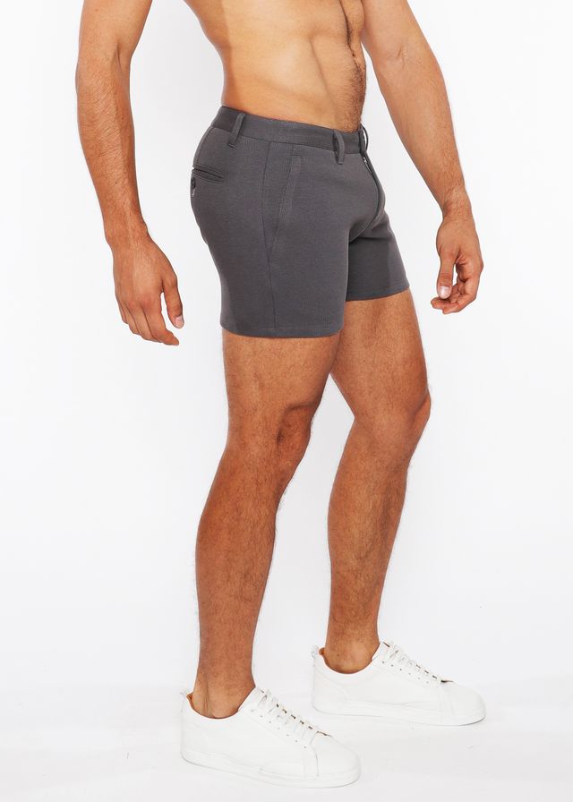Dark gray linen-look textured tailored shorts with zip pockets and subtle stitching details for modern wear