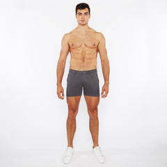A pair of dark gray slim-fit linen-look textured shorts with zip pockets and a modern clean design
