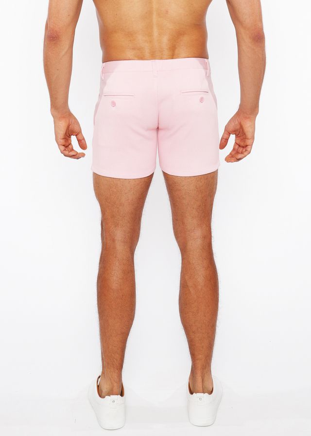 Pink linen-look textured men’s shorts with tailored fit and two back zip pockets shown from the back side
