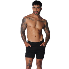 Form-fitting black short-length casual shorts with a flat front, button closure, and side pockets.