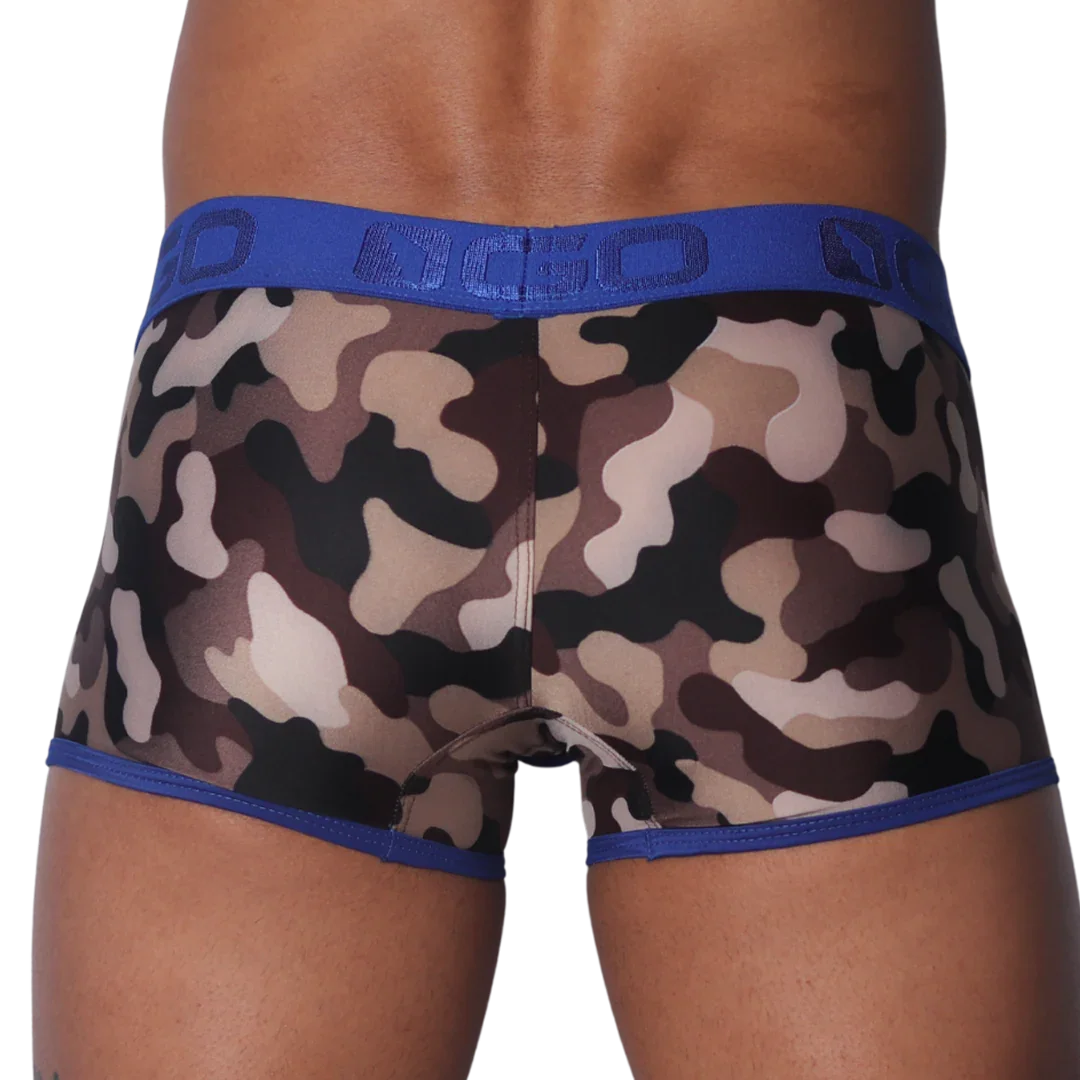 Camouflage-print trunks with a blue branded elastic waistband and blue trim along the leg openings.