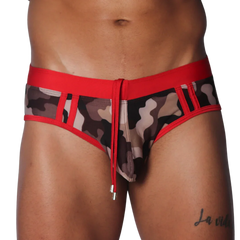Camo print swim brief with red waistband, trim, and central drawstring featuring metallic aglets.