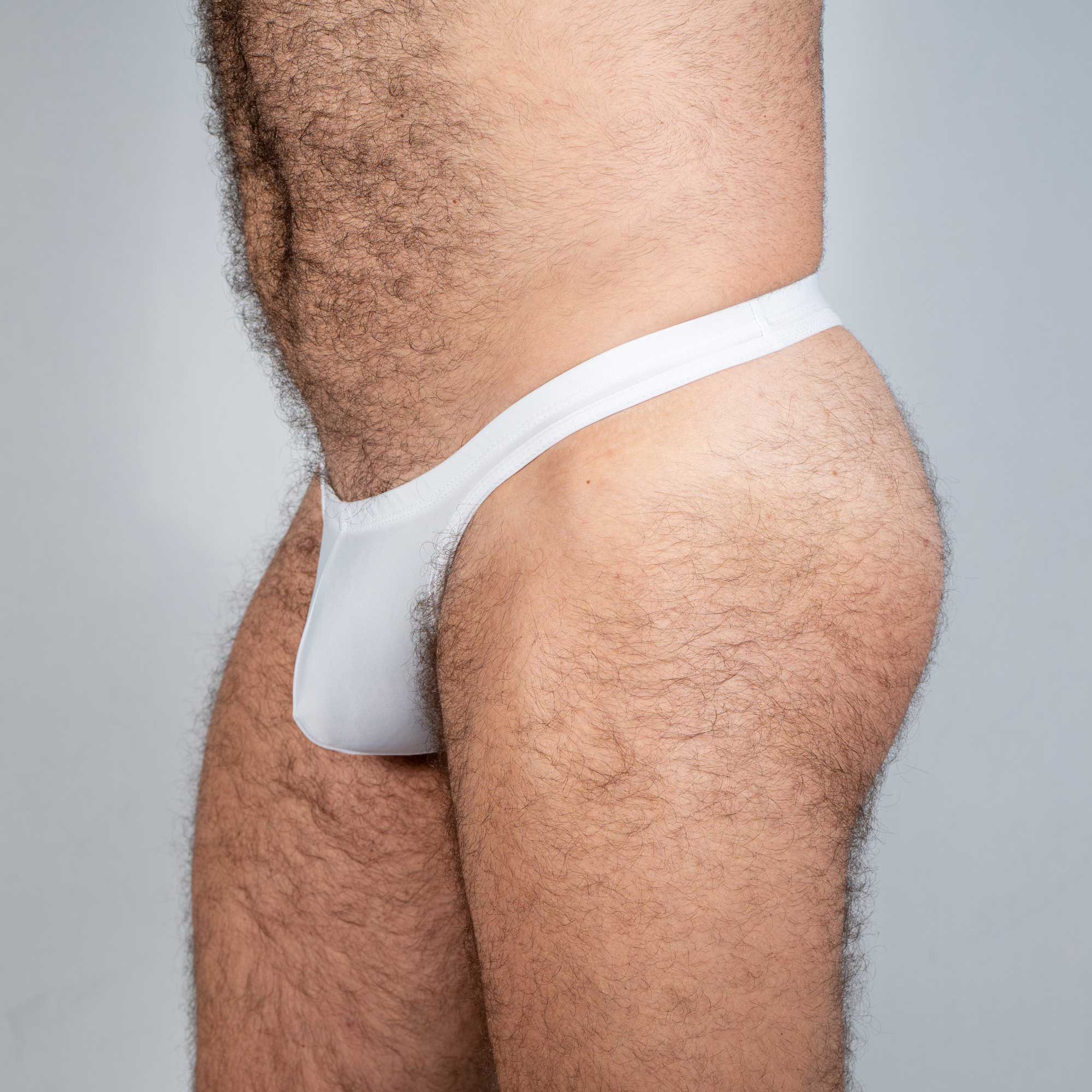 White cotton tulio swim thong with snug form-fitting design in solids collection shown from the back side