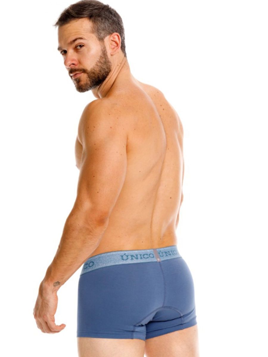 Unico 26040100117 classic trunks in teal with a light blue elastic waistband featuring the unico logo