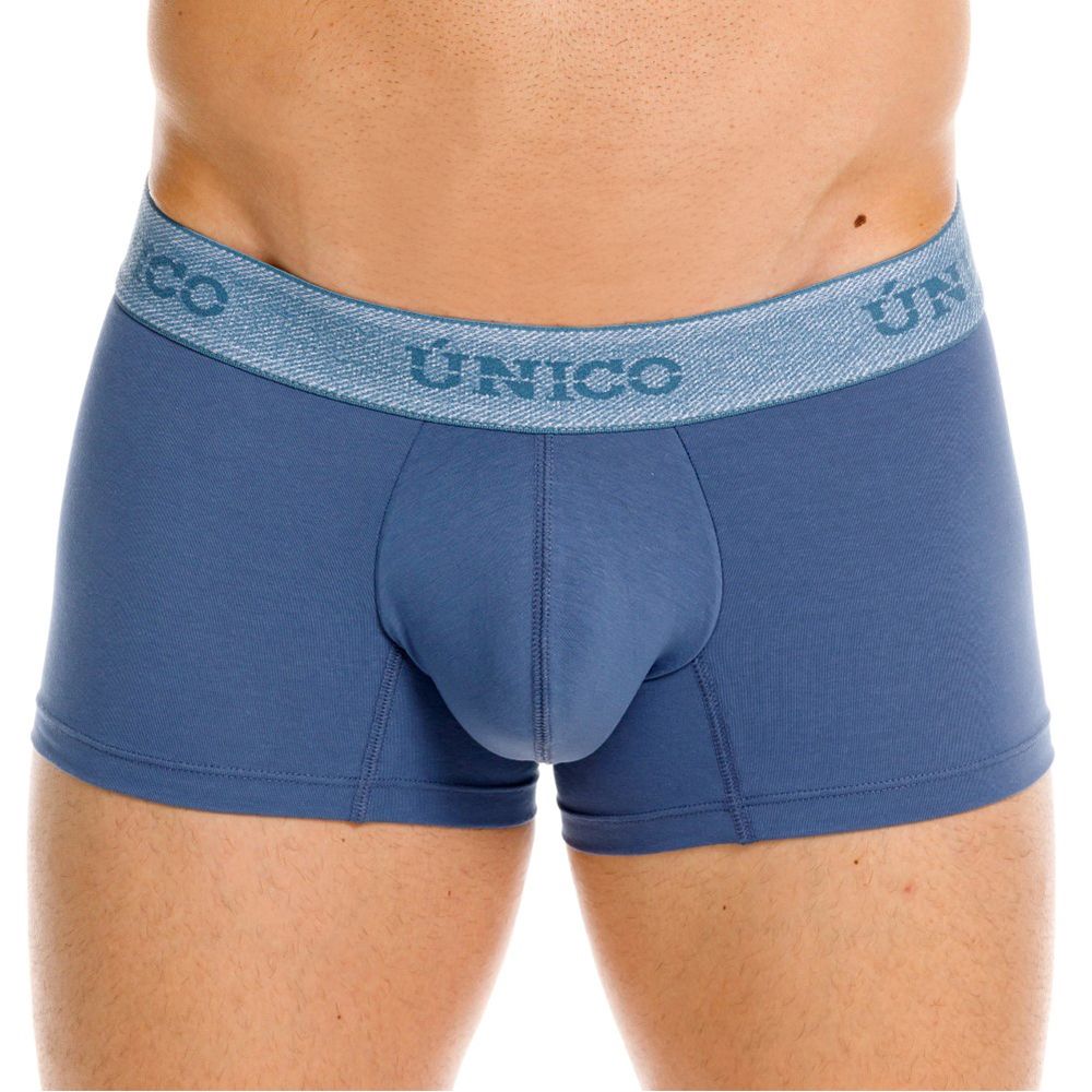 Blue unico men’s boxer briefs with textured waistband and matching blue branding in premium everyday teal color