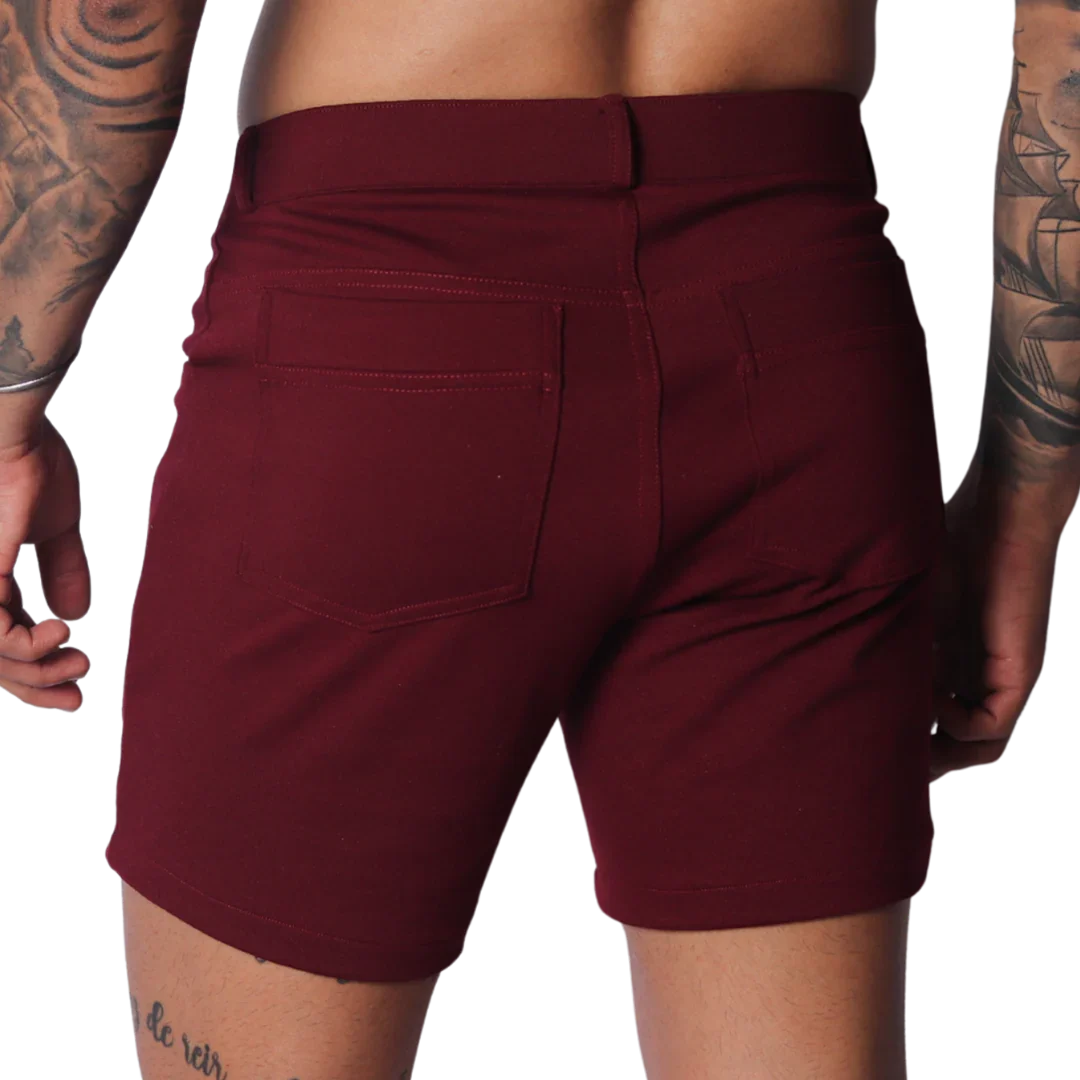 Wine-colored fitted shorts featuring a classic five-pocket design, belt loops, and smooth stretch fabric.