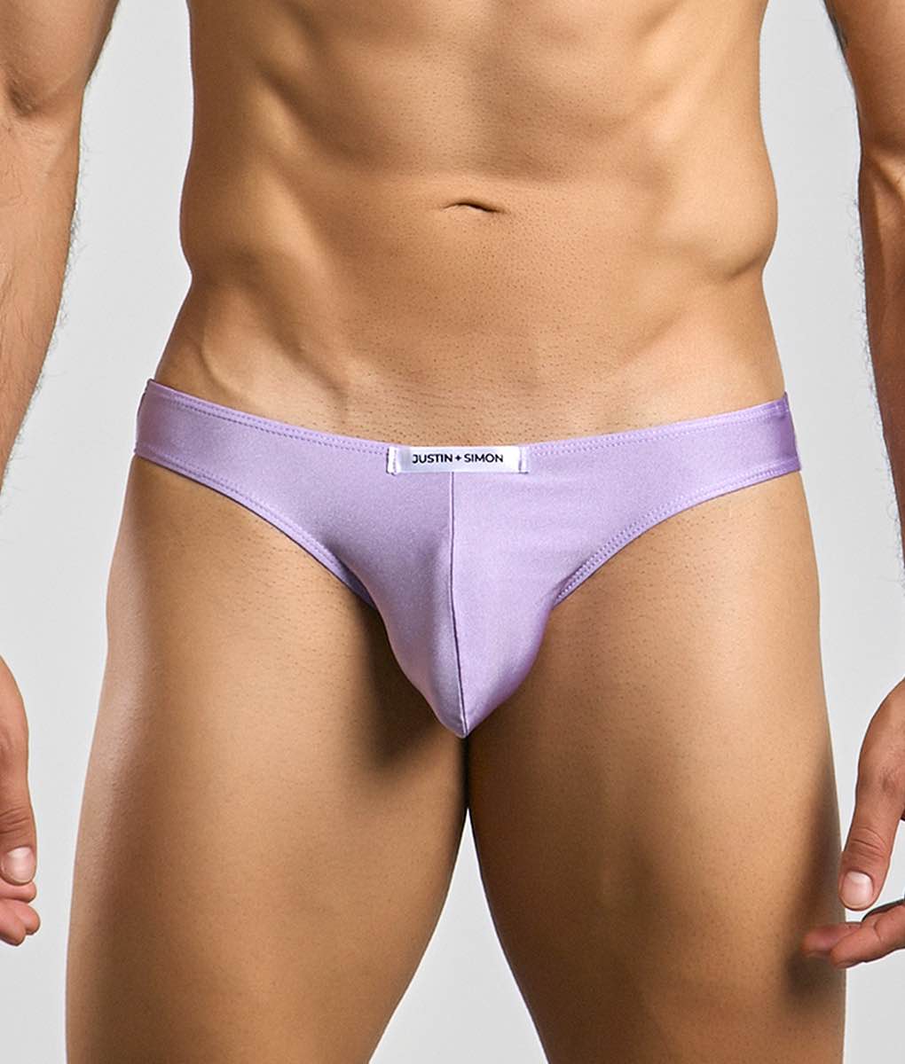 Lavender-colored justin simon classic mens bikini briefs with a sleek form-fitting design and subtle brand tag at waistband