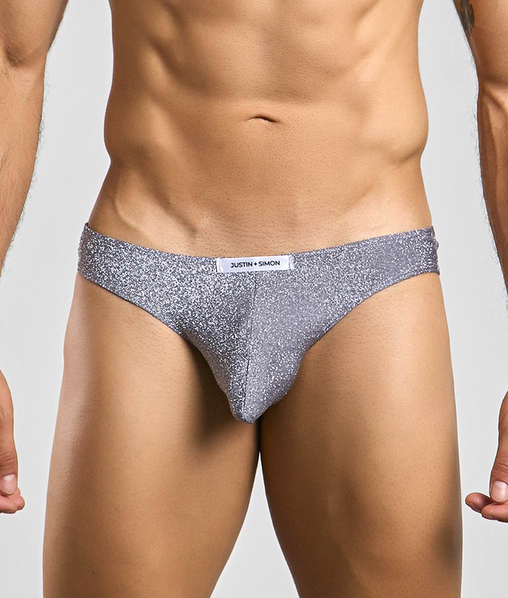 Silver glittery briefs with a white justin + simon label on the waistband classic mens bikini underwear