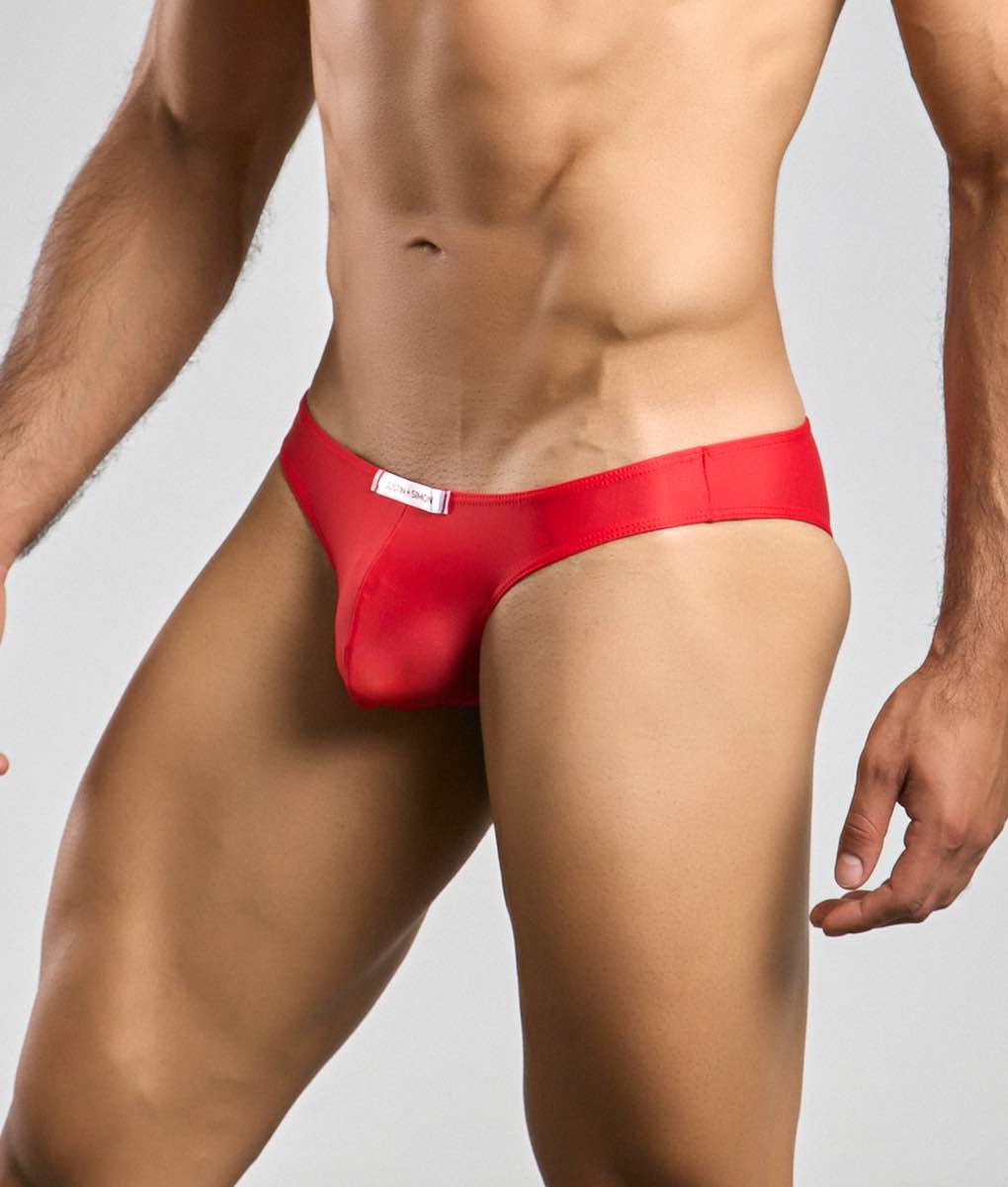 Red form-fitting mens briefs from justin simon classic mens bikini in smooth satin-like fabric with white waistband label