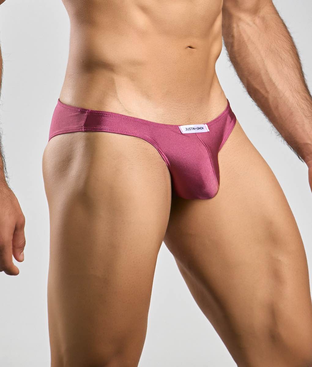 Justin + Simon classic mens bikini brief in sleek magenta satin with minimalist design and white brand tag at waistband