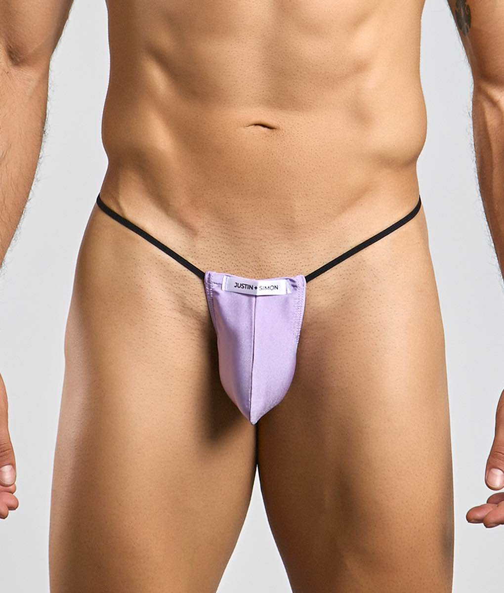 Purple justin simon classic g-string bulge thong with black elastic straps shown from the back side