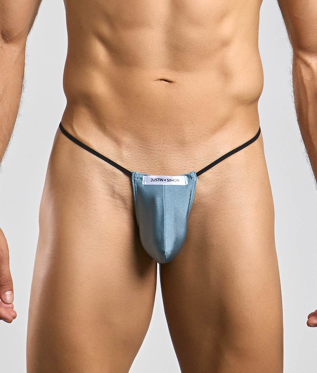 Blue justin + simon classic g-string bulge thong with black elastic straps showing front view