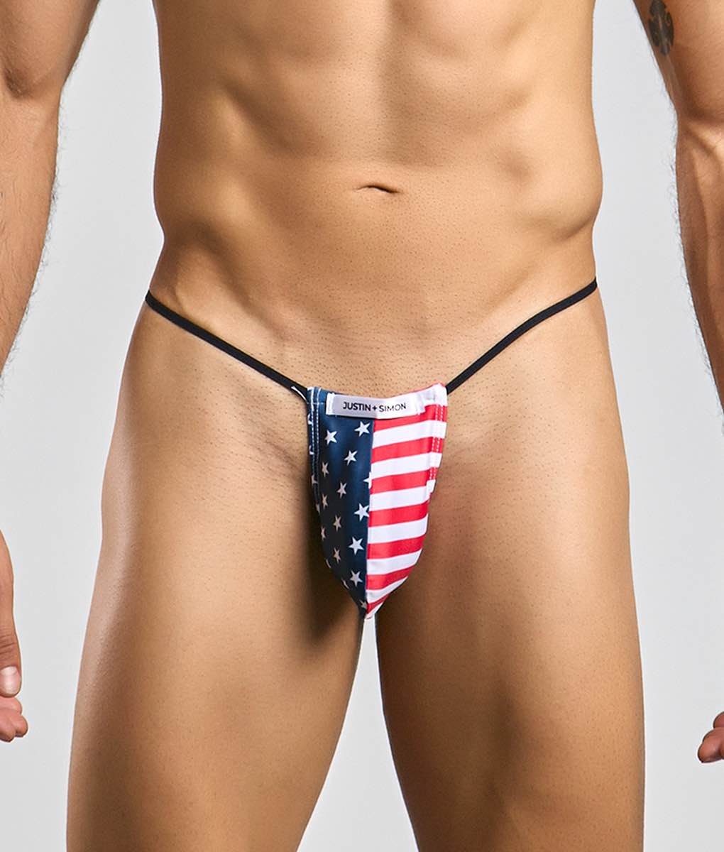 Justin simon classic g-string bulge thong with american flag design featuring red white stripes and blue stars on stretchy fabric
