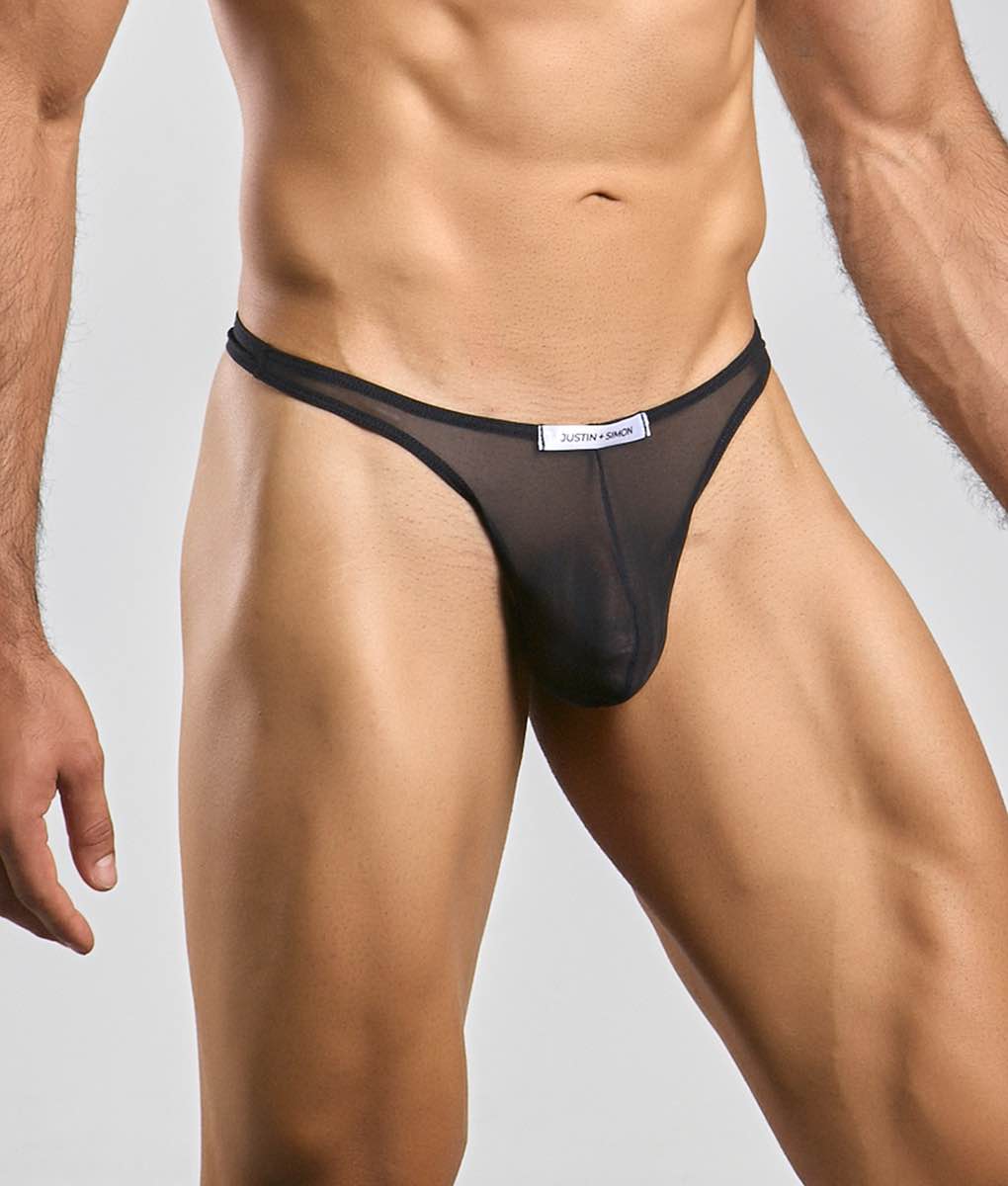 Black sheer mesh thong with white justin and simon label at waistband from the classic tanga mesh collection