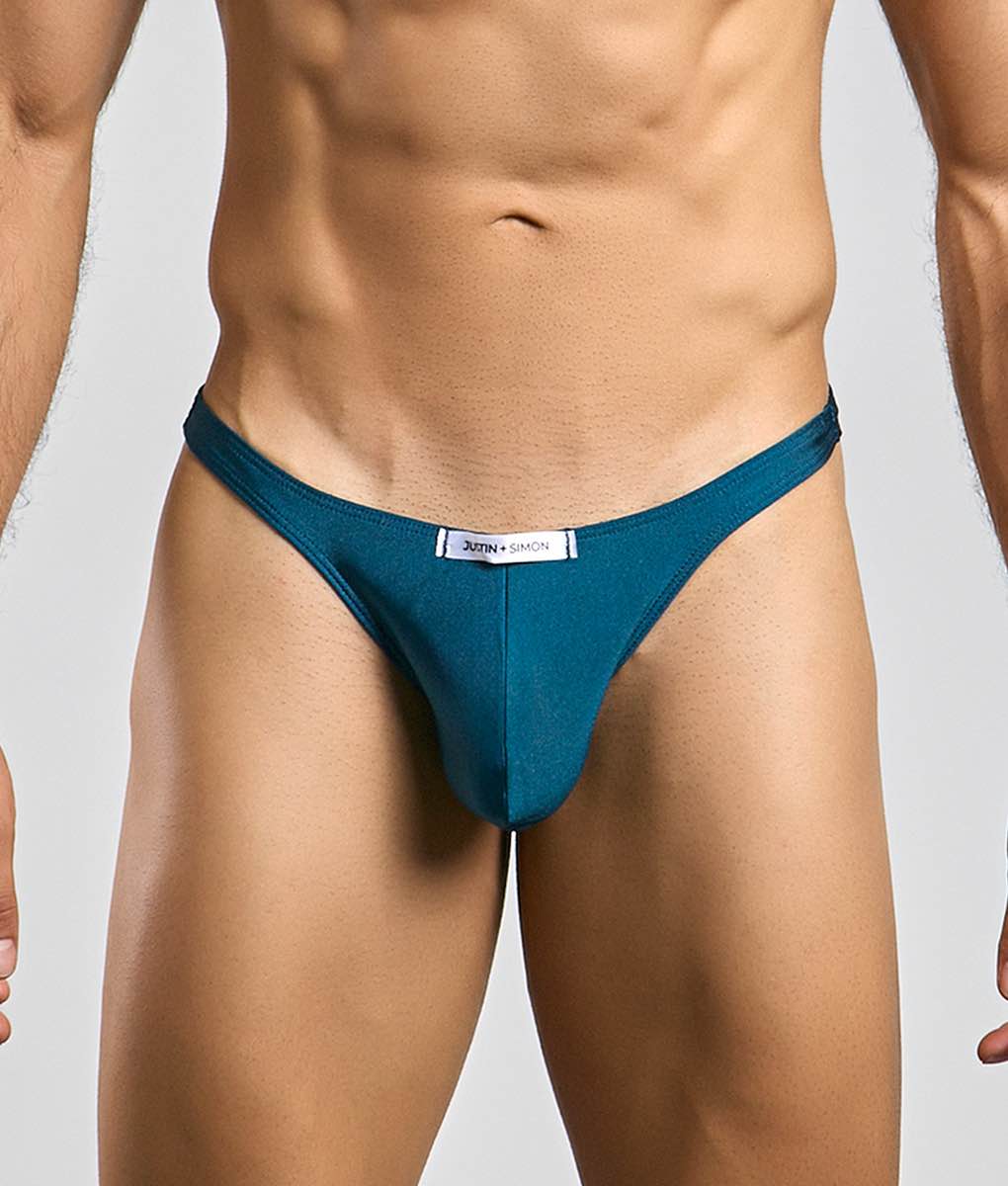 Teal-colored justin and simon classic tanga thong with sleek form-fitting design shown from the back side
