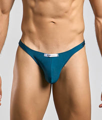 Teal-colored justin and simon classic tanga thong with sleek form-fitting design shown from the back side