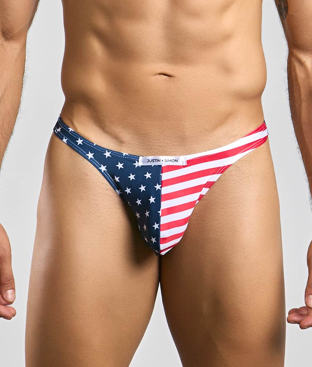 Blue and red american flag patterned thong with white stars and justin simon brand label classic tanga front view