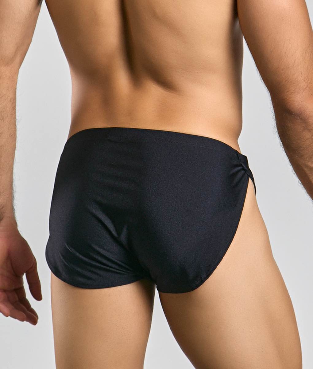 Justin + Simon running short black sleek swim trunks with tailored fit and side-tie design for comfortable wear