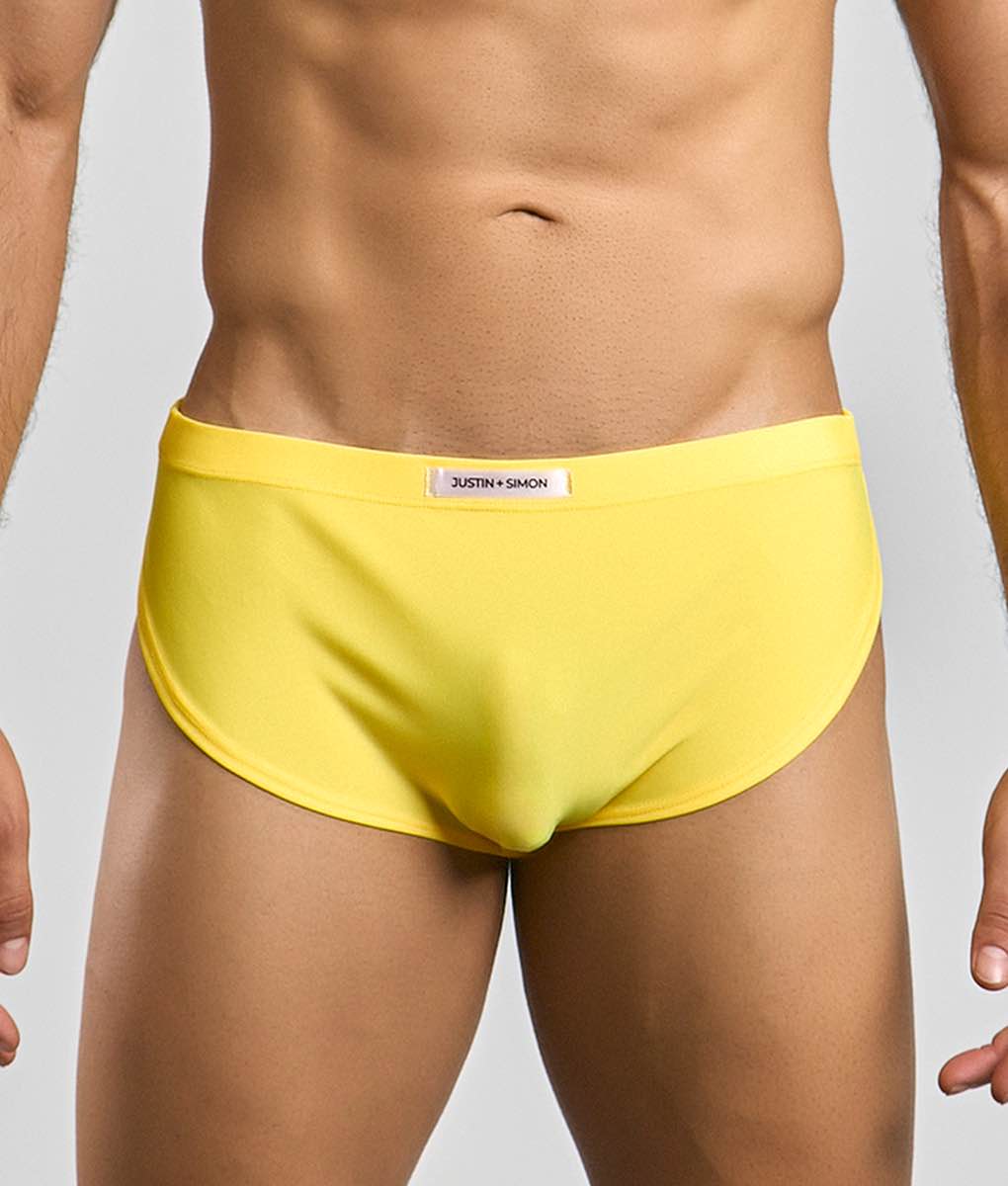 Bright yellow justin plus simon men’s briefs with smooth form-fitting fabric and subtle waistband label for running short
