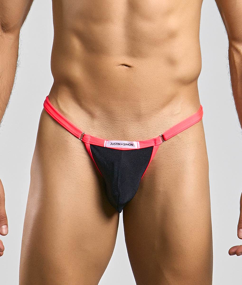 A vibrant red and black thong with a sleek minimalist design from justin + simon bikini one collection
