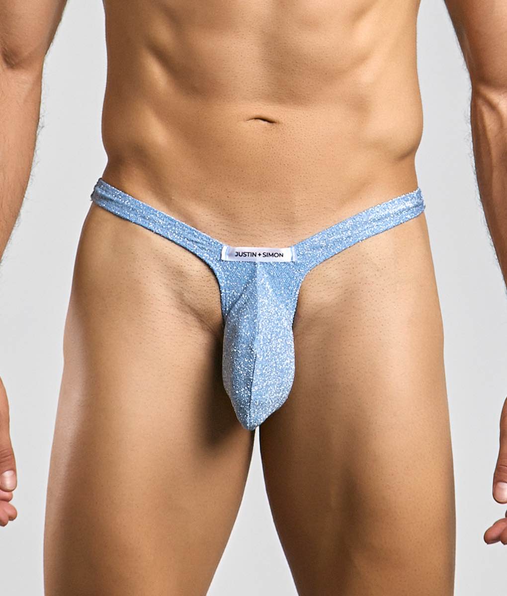Light blue glittery bulge thong by Justin + Simon with a white brand tag visible in the front view