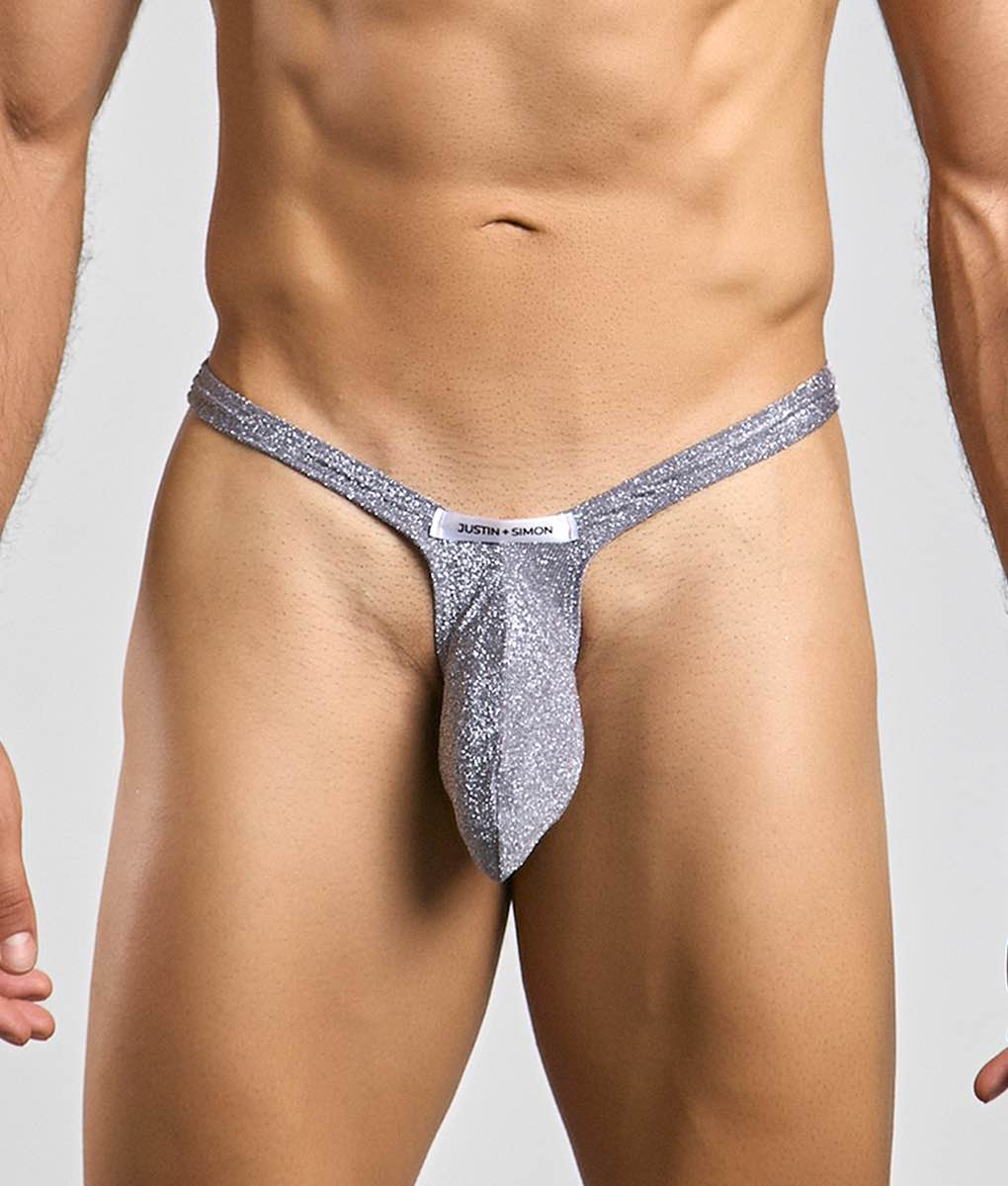 Silver glittery bulge thong with white justin plus simon label at the front for stylish men’s underwear