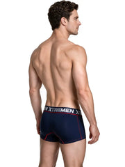 Male model wearing dark blue microfiber stretch trunks with red stitching and branded waistband by Xtremen shown from back