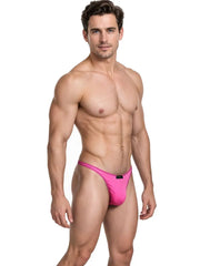 Male model wearing fuchsia sleek microfiber thong underwear with narrow sides and a small black logo tag by Xtremen