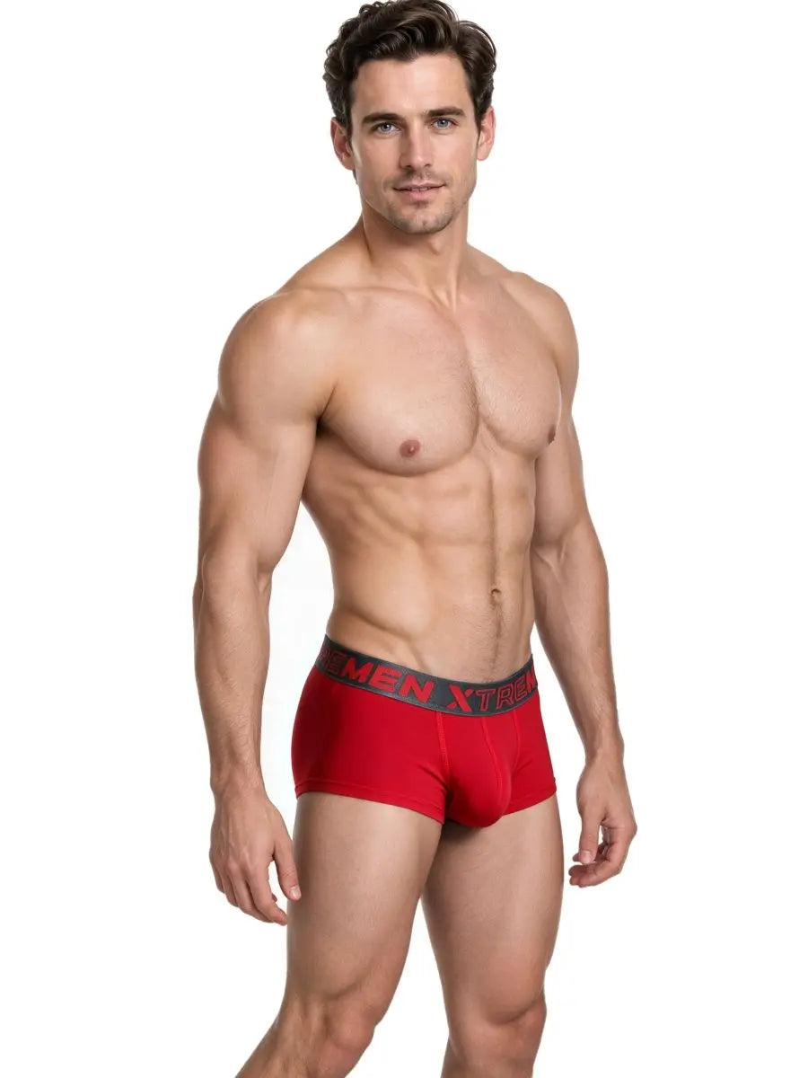 Male model wearing red microfiber briefs with black waistband featuring Xtremen branding by Xtremen