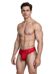 Male model wearing red sleek microfiber thong underwear with branded waistband by Xtremen