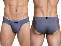 Front and back views of gray microfiber briefs with a low-rise cut and black logo tag worn by a male model by Xtremen