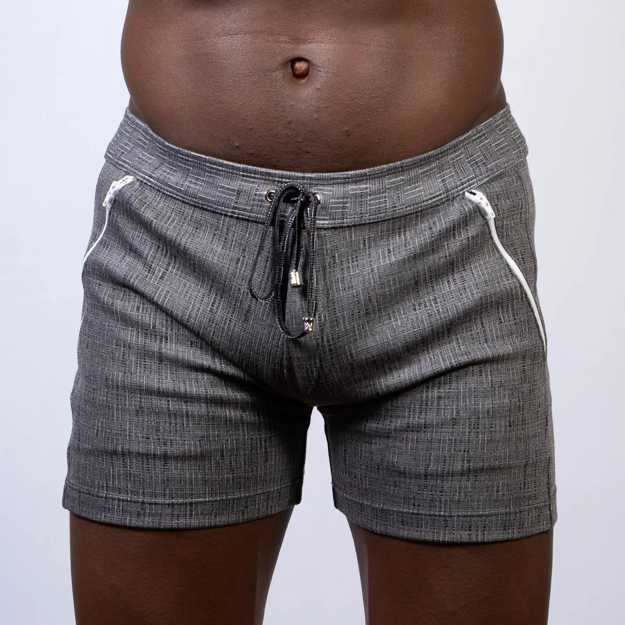 Abstract linen texture shorts in gray with textured fabric, white zipper accents, and black drawstring waistband