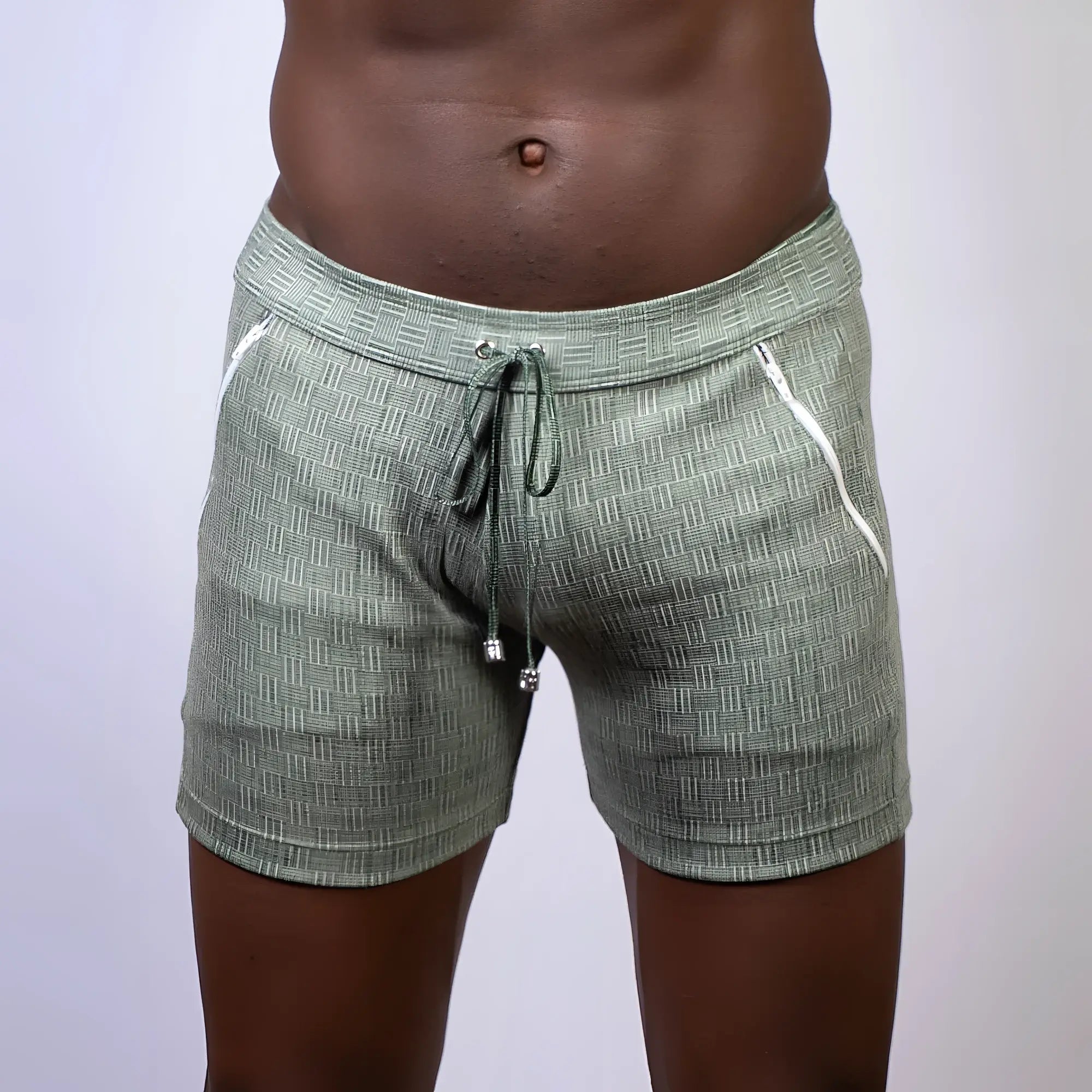 Olive green abstract linen texture shorts with white zipper accents and a drawstring waistband for casual wear